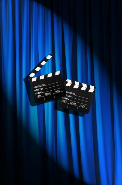 Movie clapper board against curtain — Stock Photo, Image