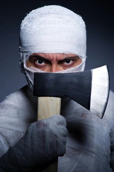 Mummy with axe in halloween concept — Stock Photo, Image