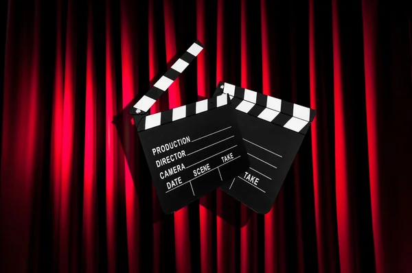 Movie clapper board against curtain — Stock Photo, Image