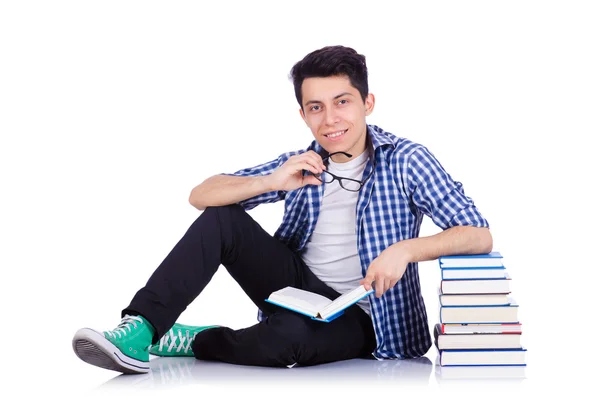 Student se spoustou knih na bílém — Stock fotografie