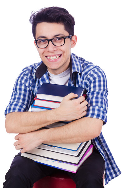 Студент с большим количеством книг на белом