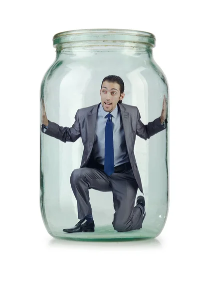 Молодой бизнесмен в стеклянной банке — стоковое фото