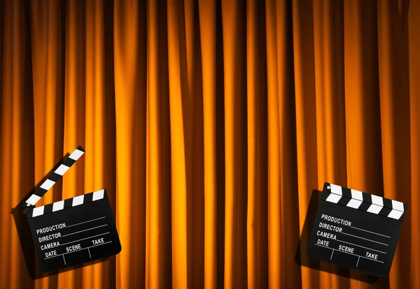 Movie clapper board against curtain — Stock Photo, Image