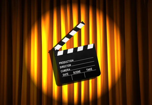 Movie clapper board against curtain — Stock Photo, Image