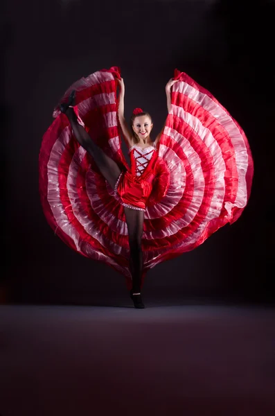 Girl in red dress dancing dance — Stock Photo, Image