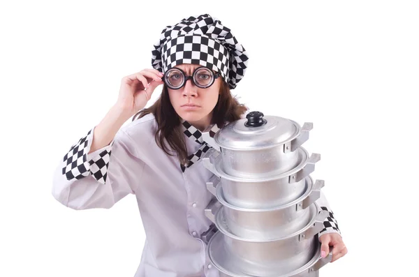 Cook with stack of pots on white — Stock Photo, Image