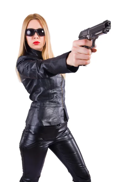 Vrouw met pistool in zwart leer kostuum — Stockfoto