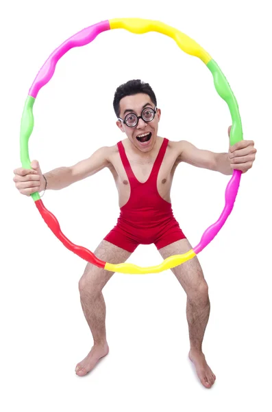 Esportista engraçado com hula hoop em branco — Fotografia de Stock
