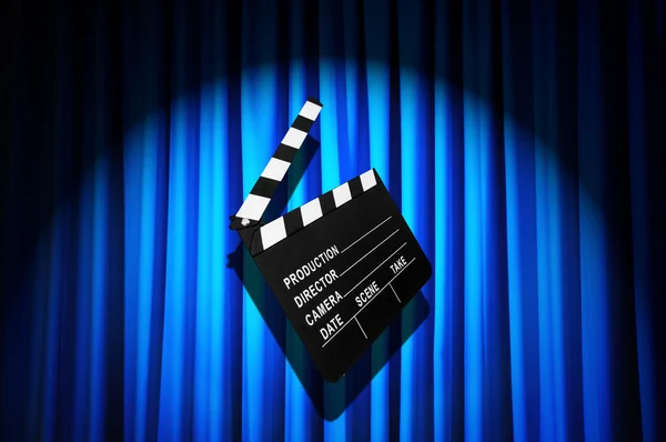 Movie clapper board against curtain — Stock Photo, Image