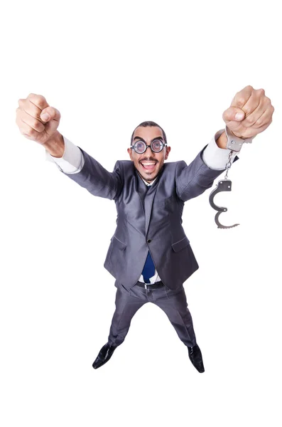 Funny businessman with handcuffs on white — Stock Photo, Image