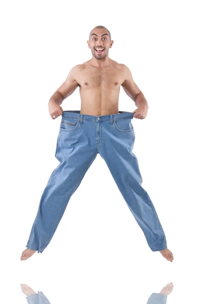 Man in dieting concept with oversized jeans — Stock Photo, Image