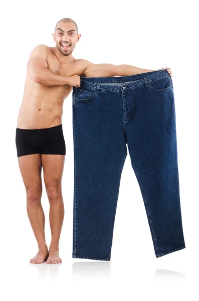 Mannen i bantning koncept med överdimensionerade jeans — Stockfoto