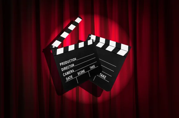 Movie clapper board against curtain — Stock Photo, Image