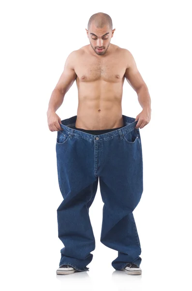 Hombre en concepto de dieta con jeans de gran tamaño — Foto de Stock