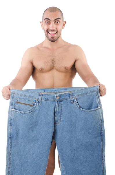Homem em dieta conceito com jeans de grandes dimensões — Fotografia de Stock