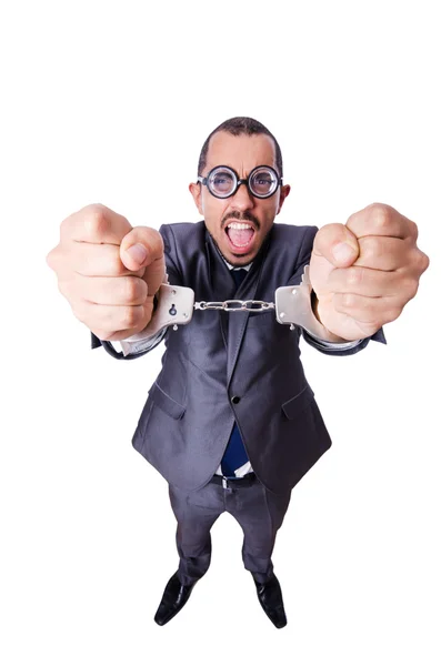 Funny businessman with handcuffs on white — Stock Photo, Image