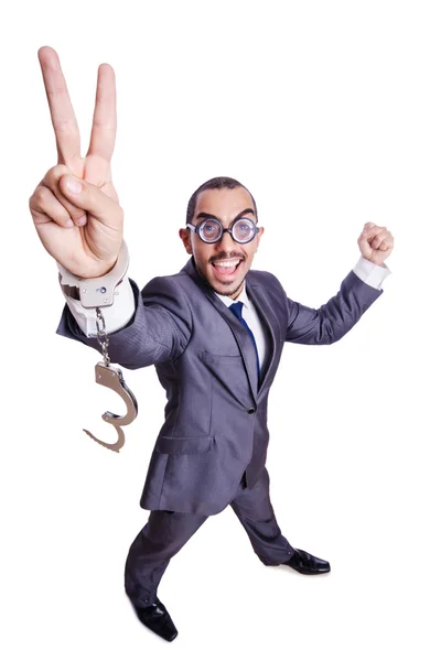 Funny businessman with handcuffs on white — Stock Photo, Image