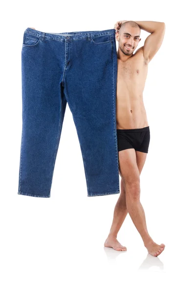 Mannen i bantning koncept med överdimensionerade jeans — Stockfoto