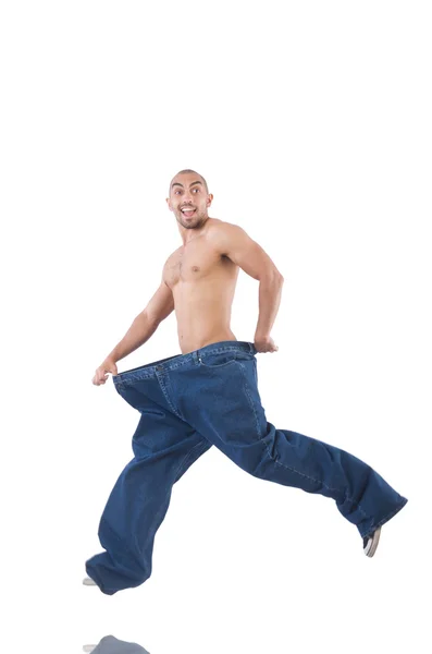 Mannen i bantning koncept med överdimensionerade jeans — Stockfoto