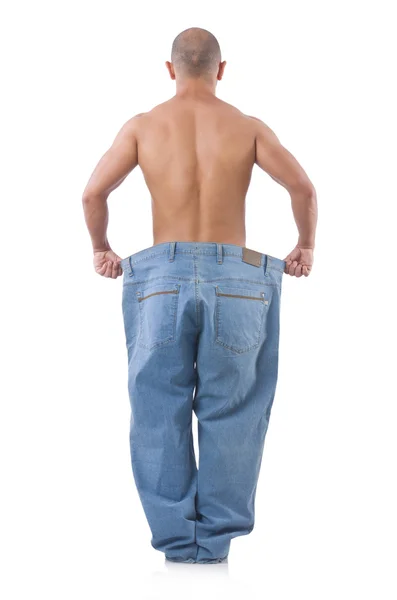 Mies laihduttaminen käsite ylisuuret farkut — kuvapankkivalokuva