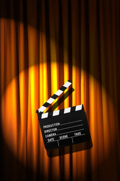 Movie clapper board against curtain — Stock Photo, Image