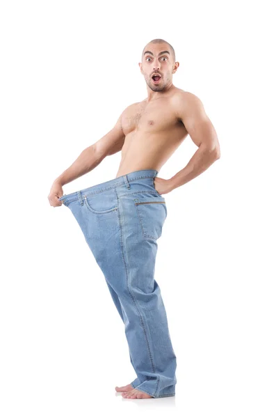 Mann im Diätkonzept mit übergroßen Jeans — Stockfoto