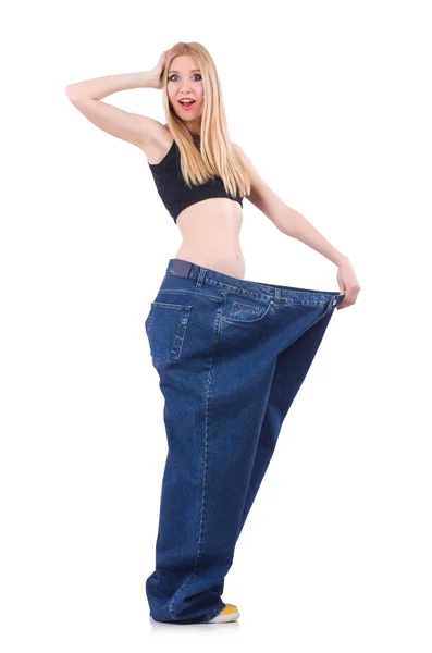 Woman in dieting concept with big jeans — Stock Photo, Image