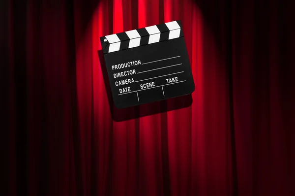 Movie clapper board against curtain — Stock Photo, Image