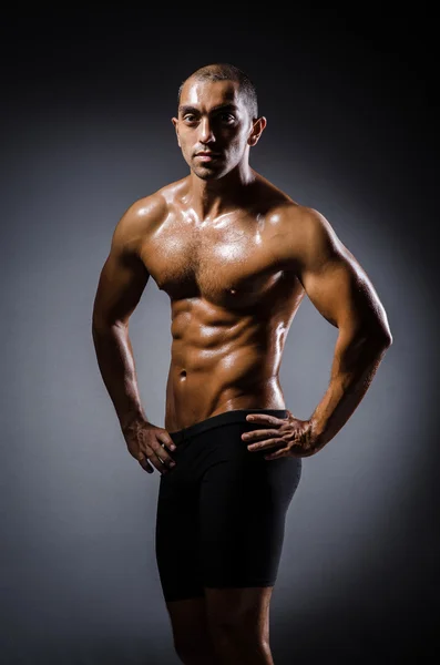 Jonge man geript in bodybuilding concept — Stockfoto