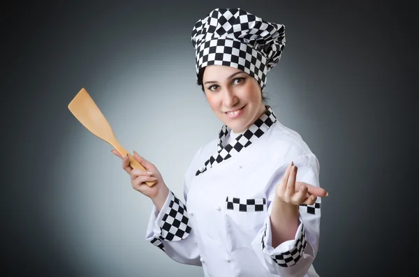 Pretty cook with kitchen utensils — Stock Photo, Image