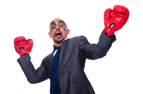 Empresário duramente espancado com luvas de boxe — Fotografia de Stock