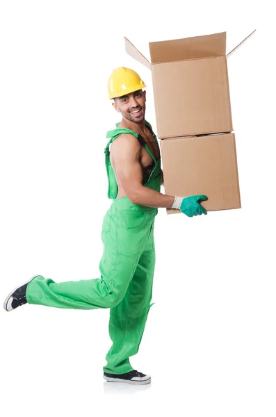 Hombre en mono verde con cajas — Foto de Stock