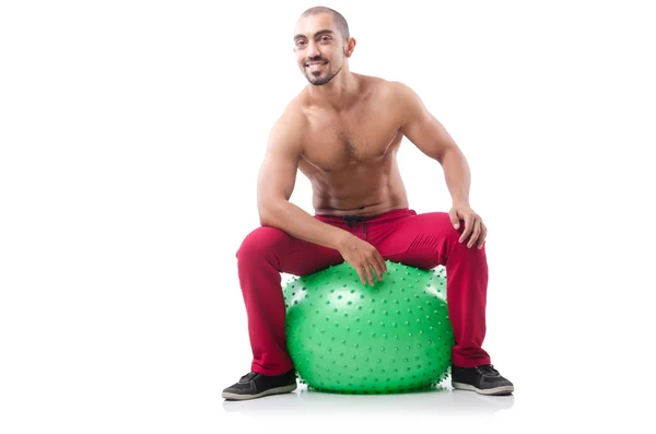 Man sitting on ball — Stock Photo, Image