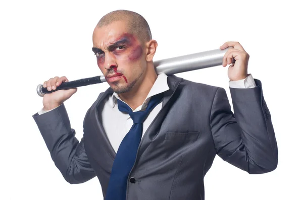 Badly bruised businessman with bat — Stock Photo, Image