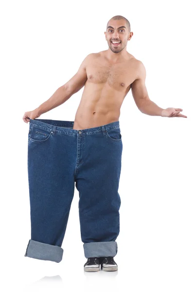 Mann im Diätkonzept trägt überdimensionale Jeans — Stockfoto