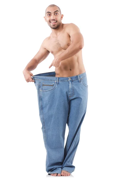Hombre en concepto de dieta con pantalones vaqueros de gran tamaño —  Fotos de Stock