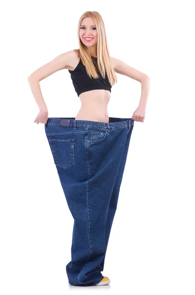 Woman in dieting concept with big jeans — Stock Photo, Image