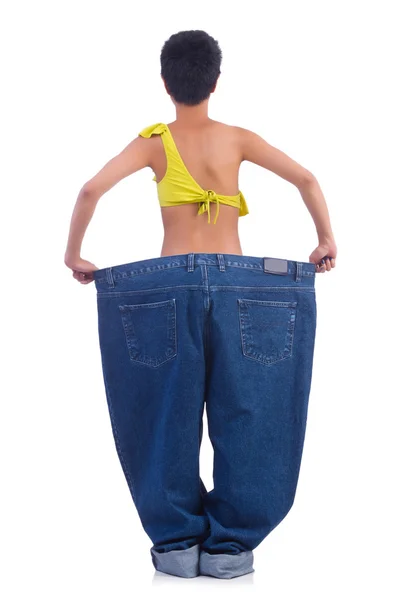 Mujer en concepto de dieta con jeans grandes — Foto de Stock