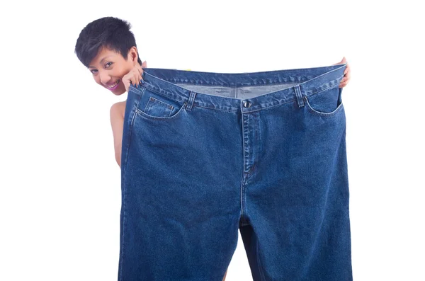 Woman in dieting concept with big jeans — Stock Photo, Image