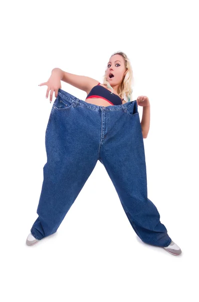 Woman in dieting concept with big jeans — Stock Photo, Image