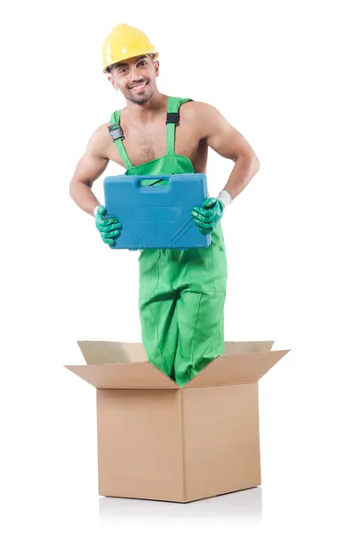 Man in coveralls with box — Stock Photo, Image