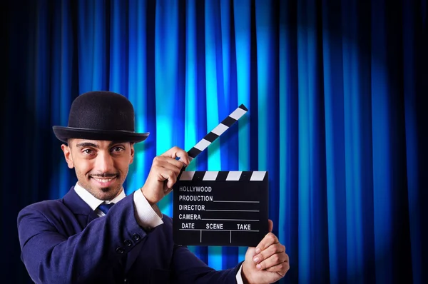 Man with movie clapper — Stock Photo, Image