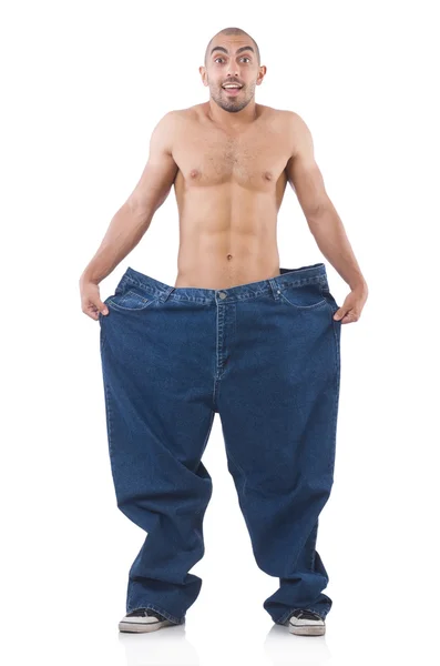 Homem em dieta conceito com jeans de grandes dimensões — Fotografia de Stock