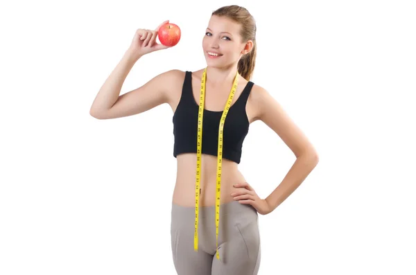 Woman standing with apple and measure tape — Stock Photo, Image