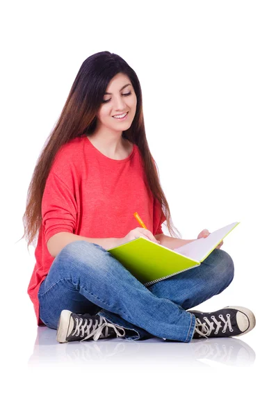 Junge Studentin mit Büchern auf weiß — Stockfoto