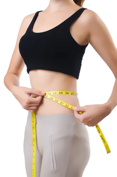 Молодая девушка с сантиметром в диете — стоковое фото