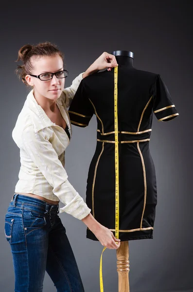 Woman tailor working on clothing — Stock Photo, Image