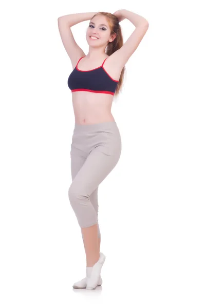Молодая женщина делает упражнения на белом — стоковое фото