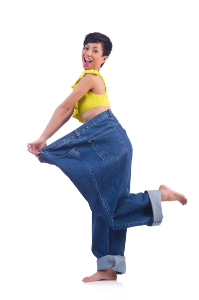 Woman in dieting concept with big jeans — Stock Photo, Image