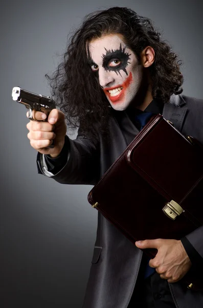Джокер з гармати і портфель — стокове фото